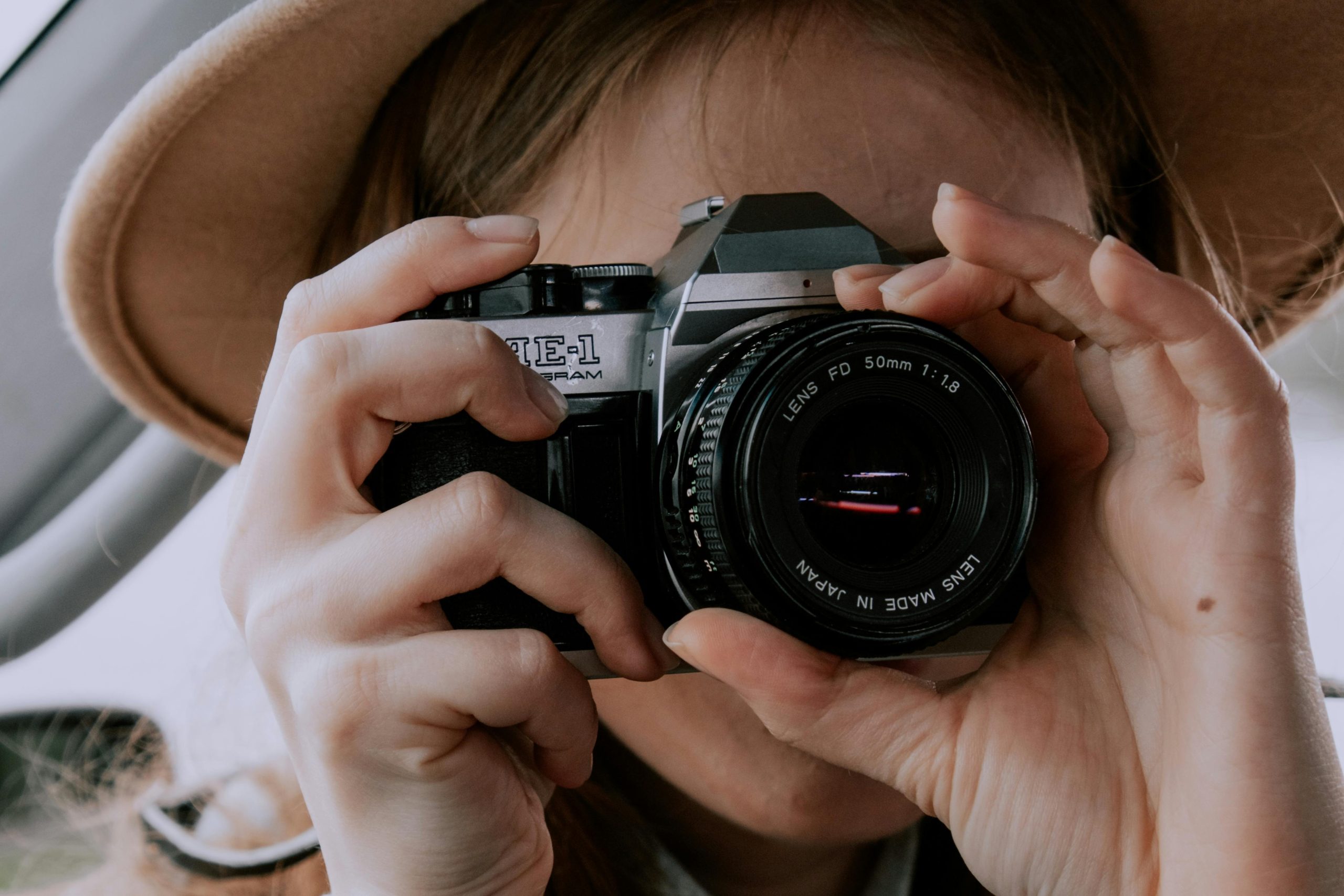 Person Holding Black Camera